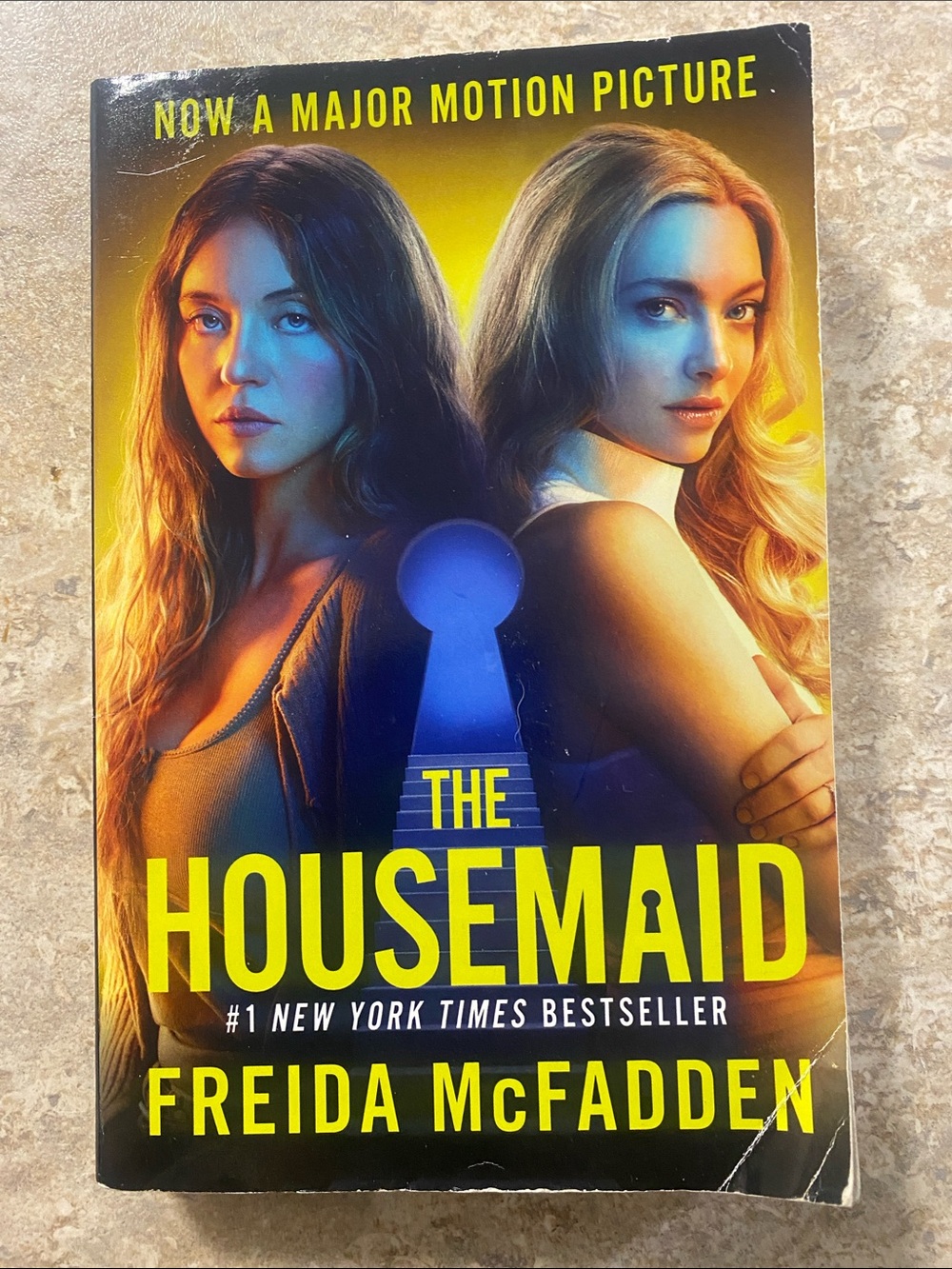 The Housemaid by Freida McFadden — Yellow & Blue Paperback Novel